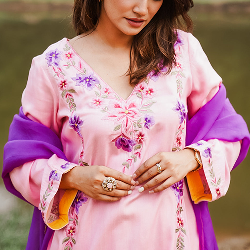 A woman wearing Purple and Blue Kurta Set with Yellow Colored Pants and Dupatta.