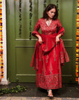 A women wearing Red Anarkali Suit Set with Dupatta.