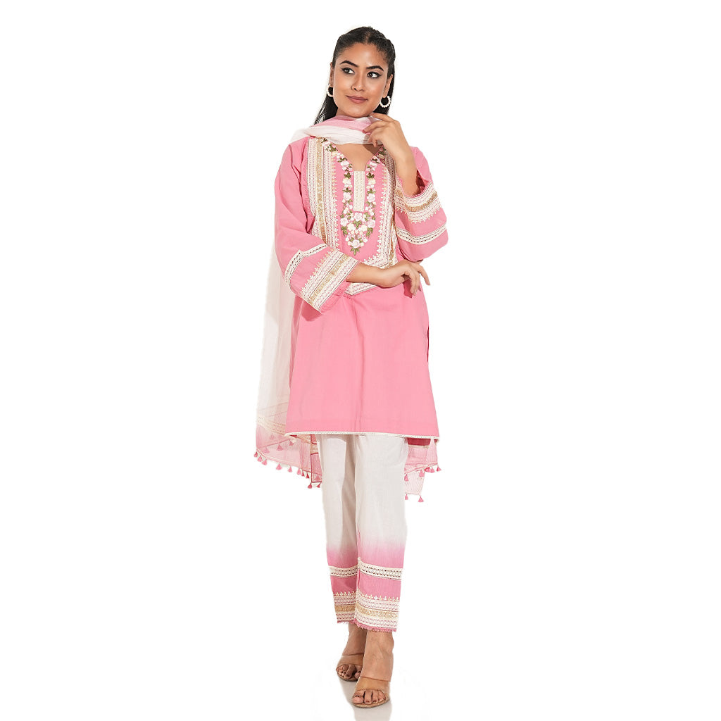 A women wearing pink and white suit set with beautiful dupatta.