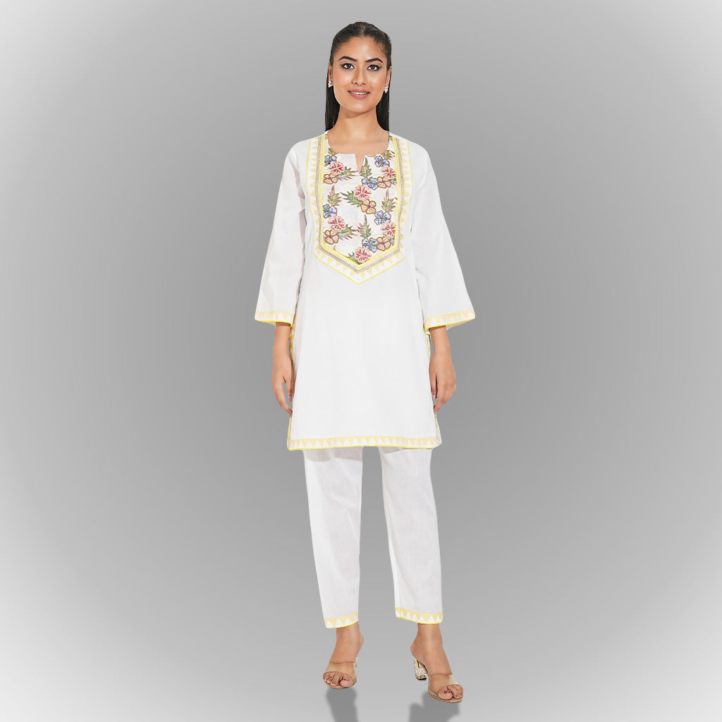 A women wearing white colored kurta set.