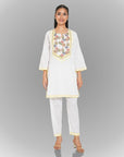 A women wearing white colored kurta set.