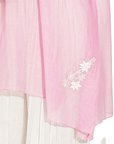 A woman wearing white and pink colored co-ord set.