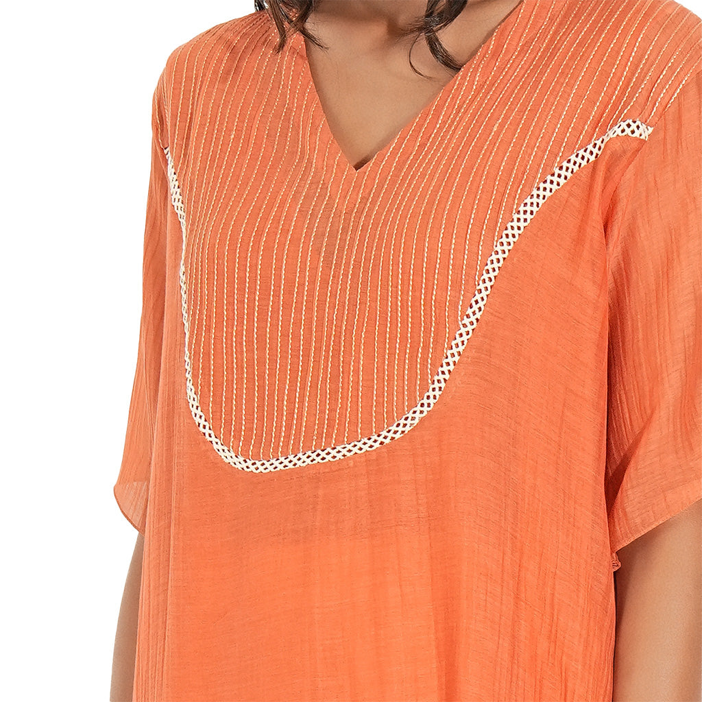 A women wearing Orange Kurta Set.