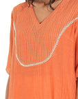 A women wearing Orange Kurta Set.