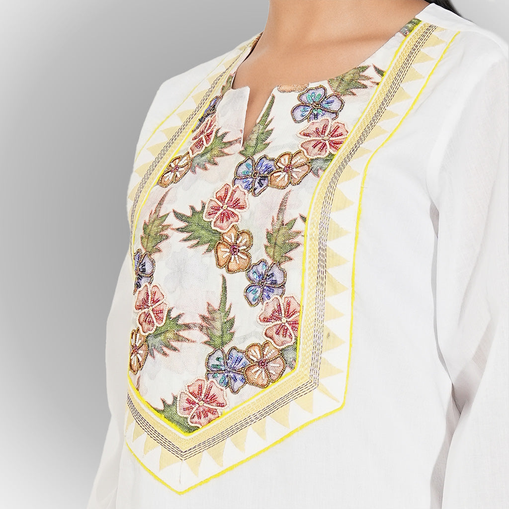 A women wearing white colored kurta set.